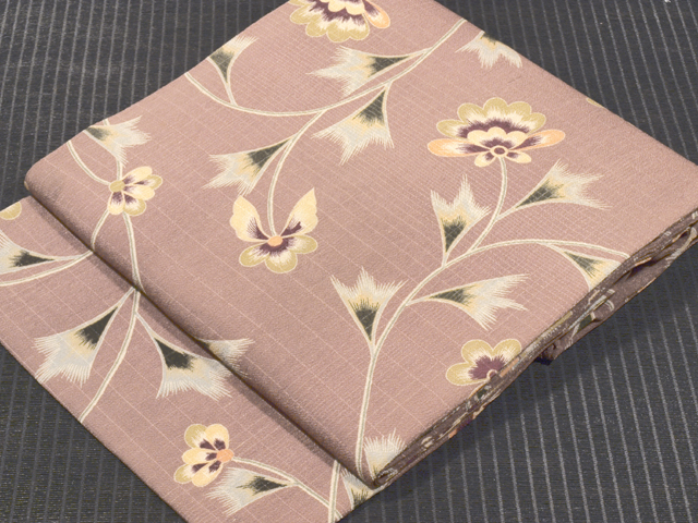 格子縞の紋織に唐花文様 型染め 名古屋帯
